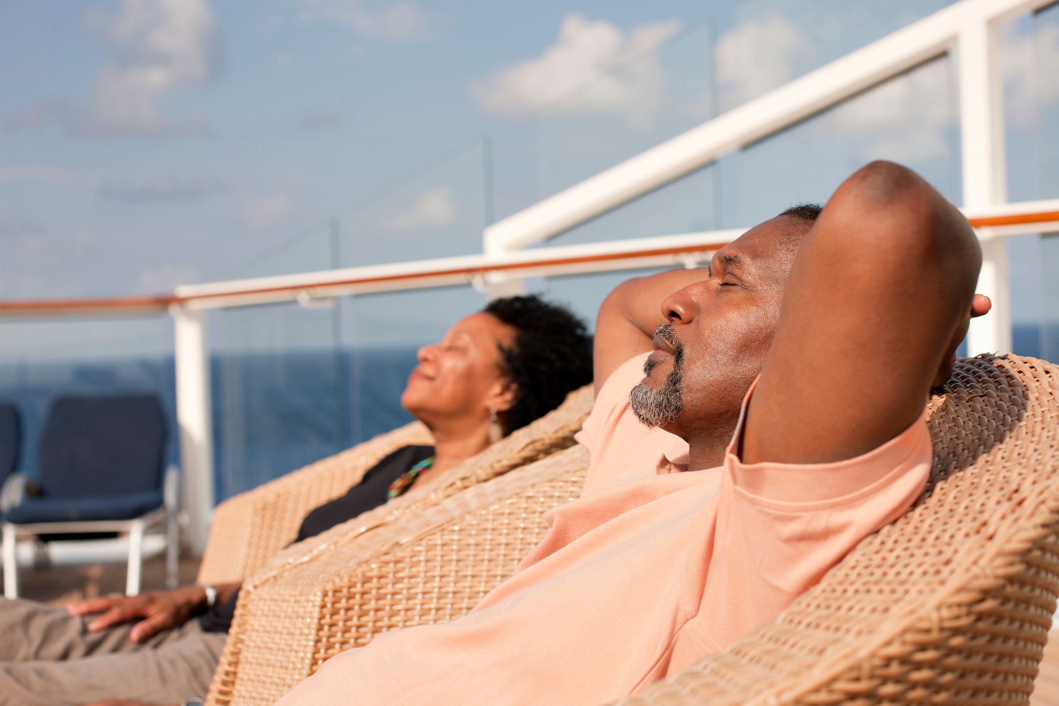 Couple sunbathing on cruise ship deck