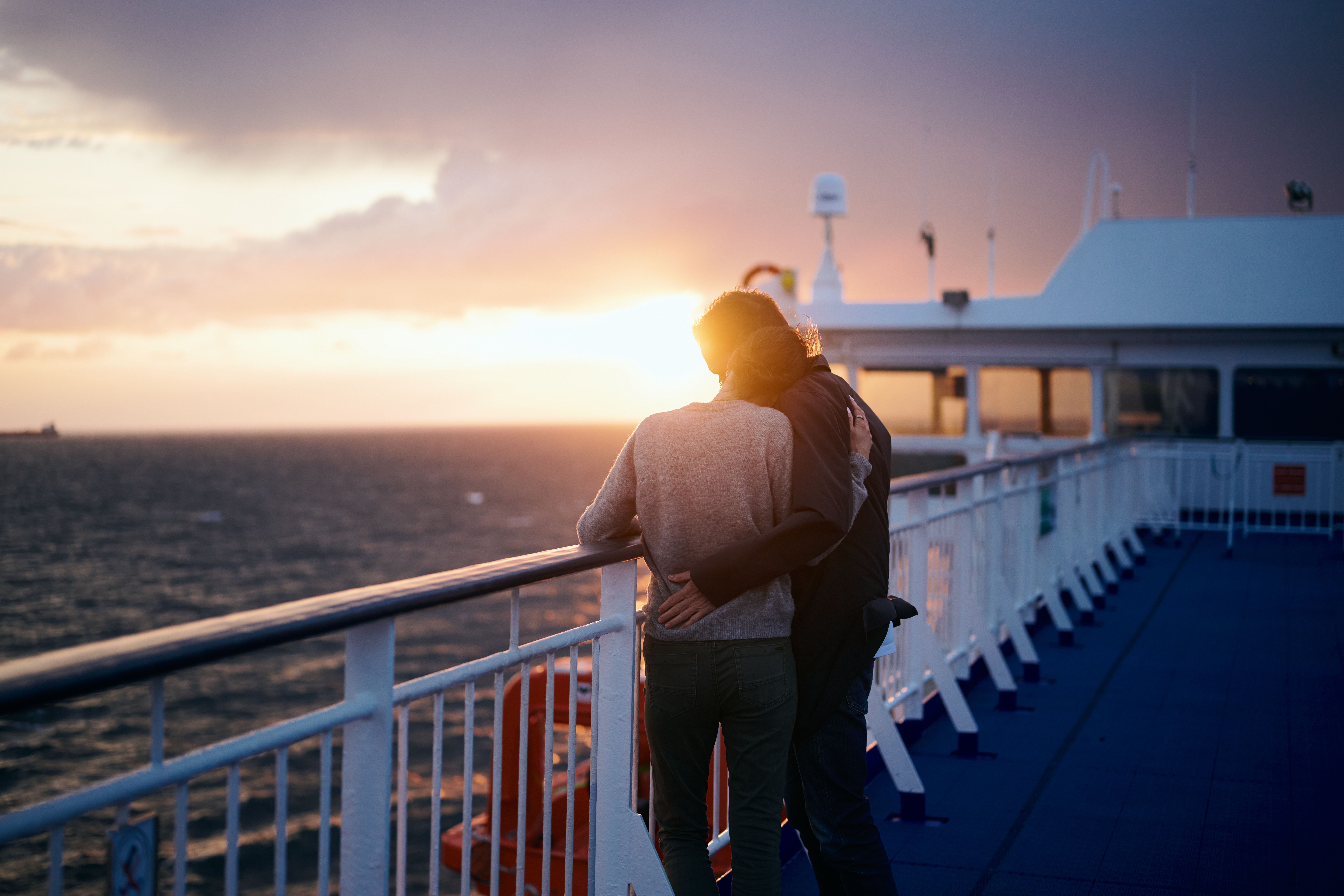 Couple admiring the sunset over the North Sea