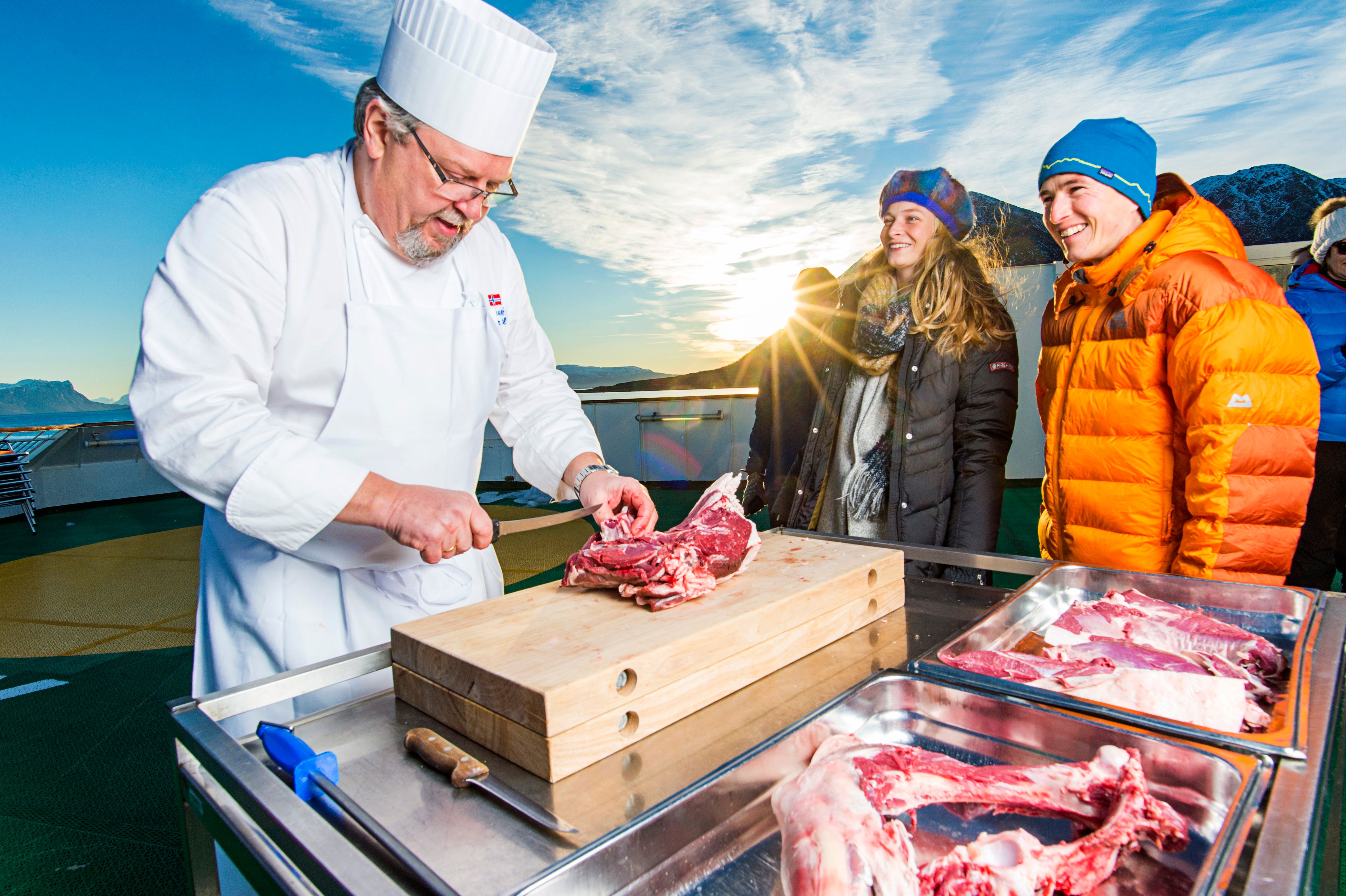 On board chef chopping meat