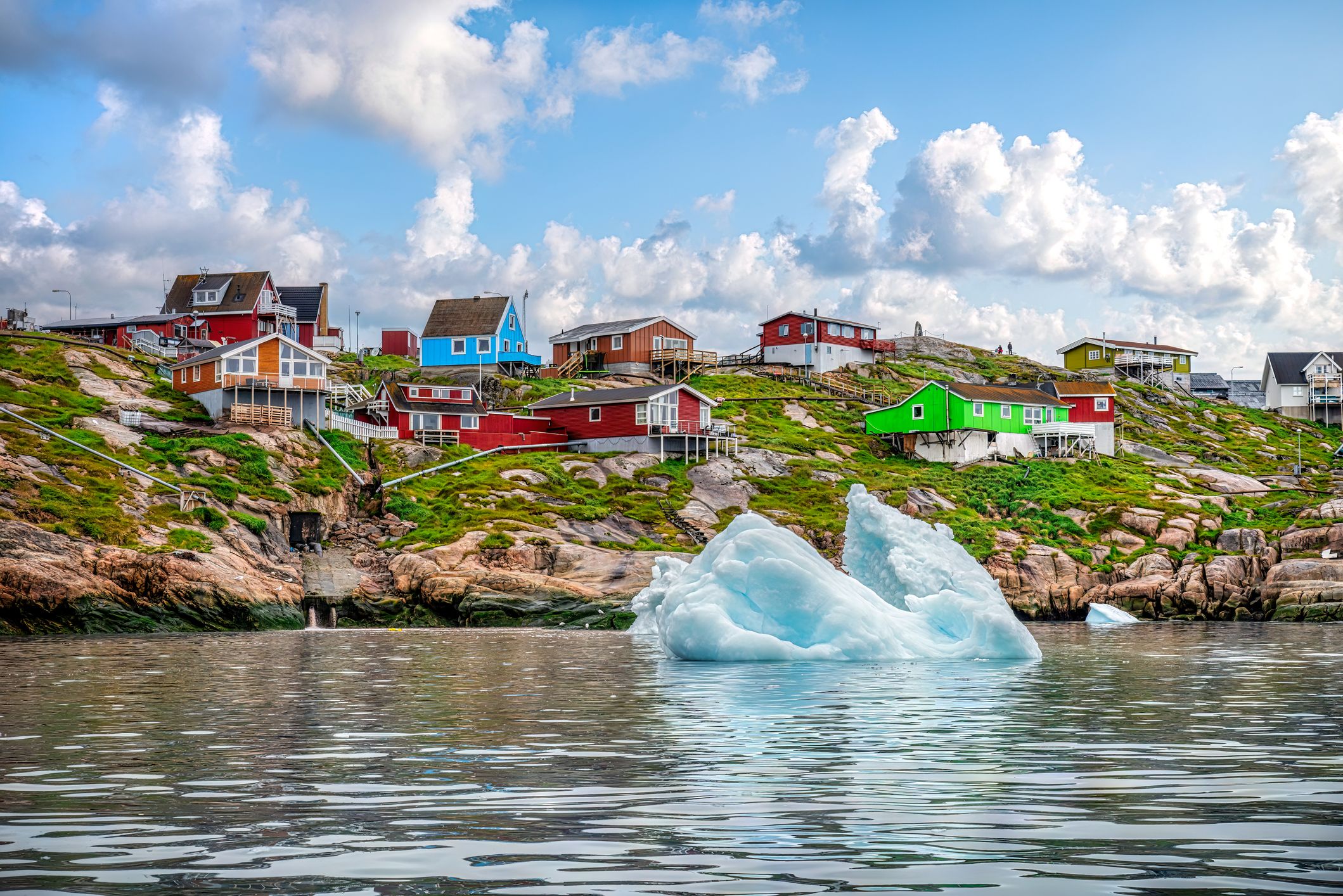 Iceberg in front of Greenland village