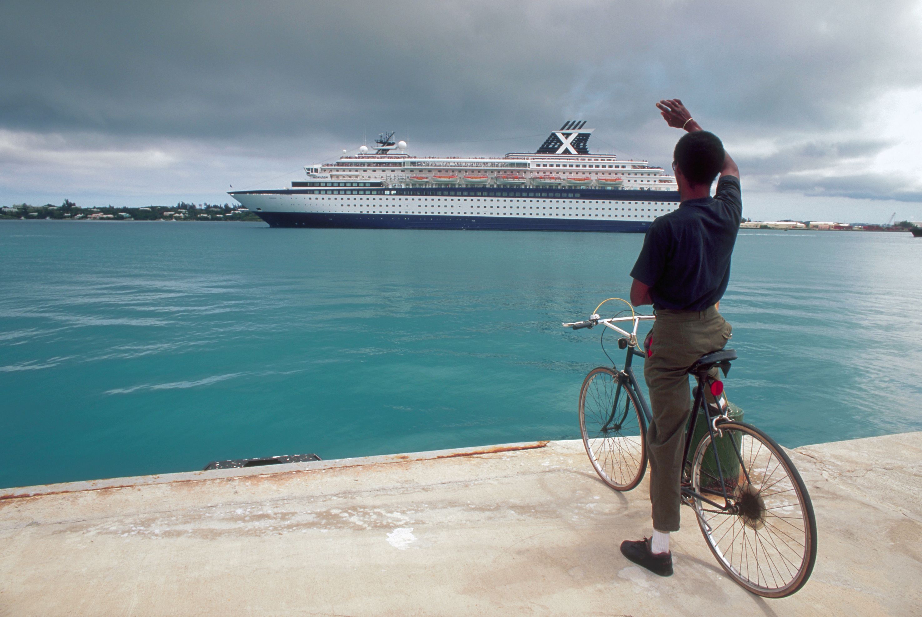 cyclist in front of cruise ship