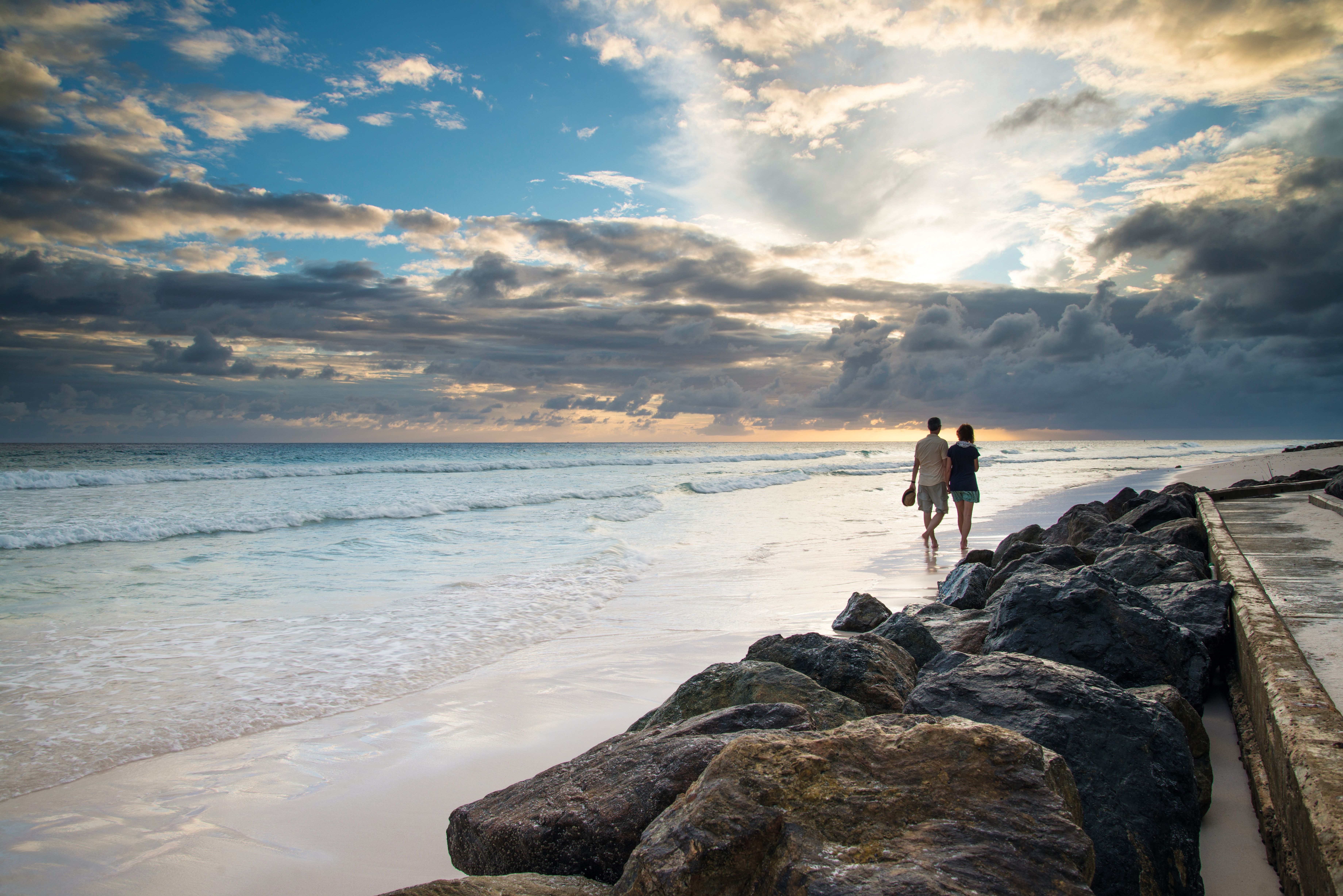 Couple walking on Caribbean beach