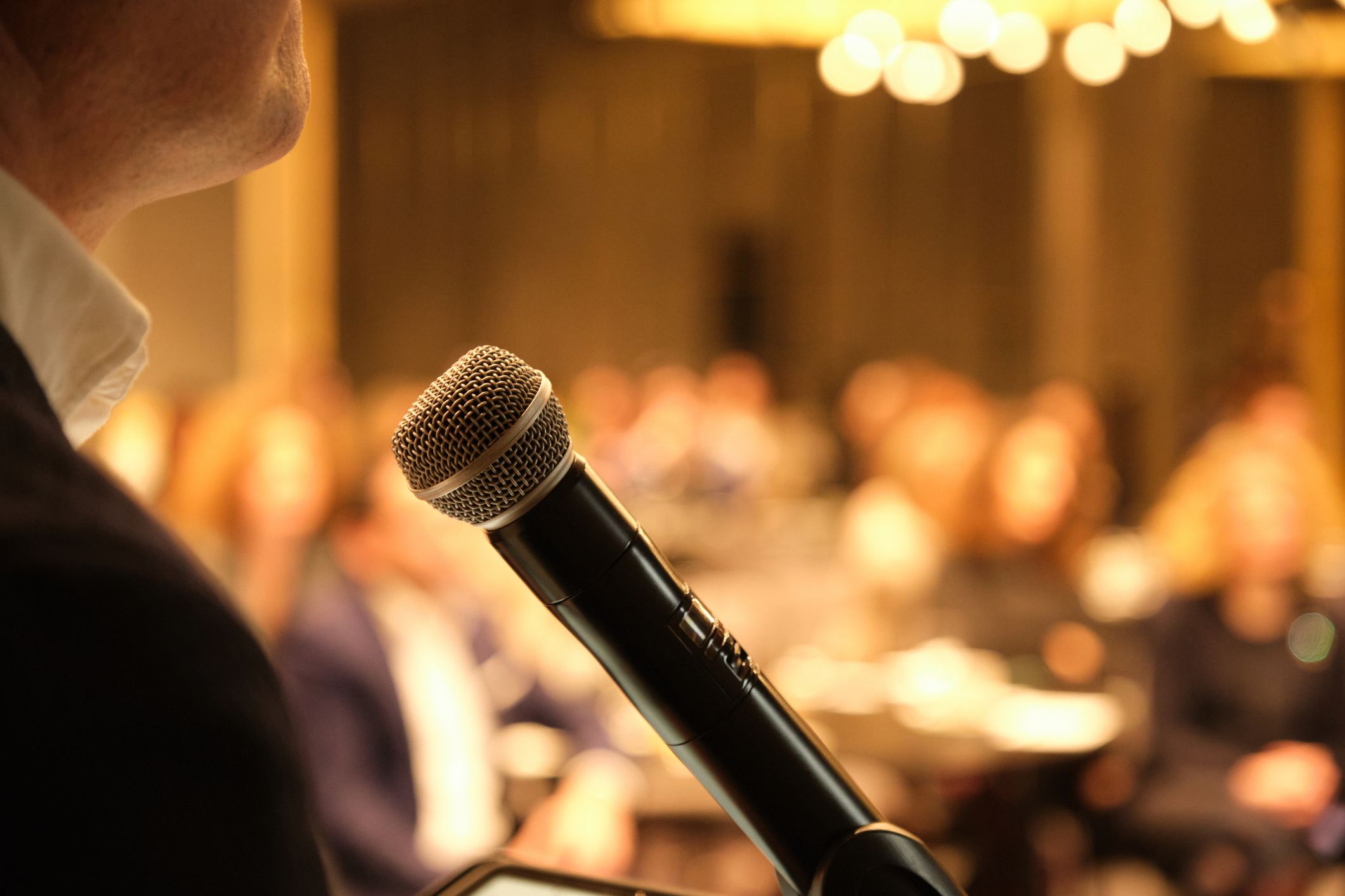 person on microphone