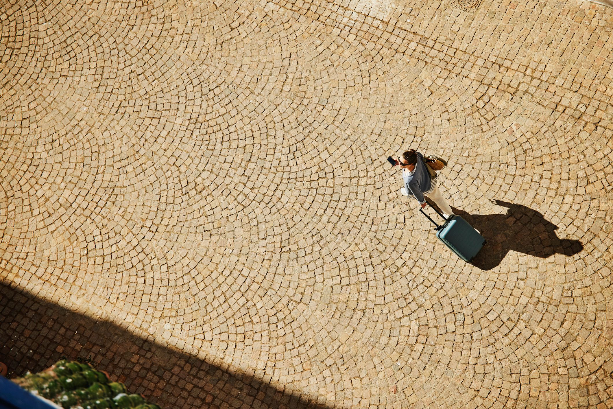 suitcase cobbled street