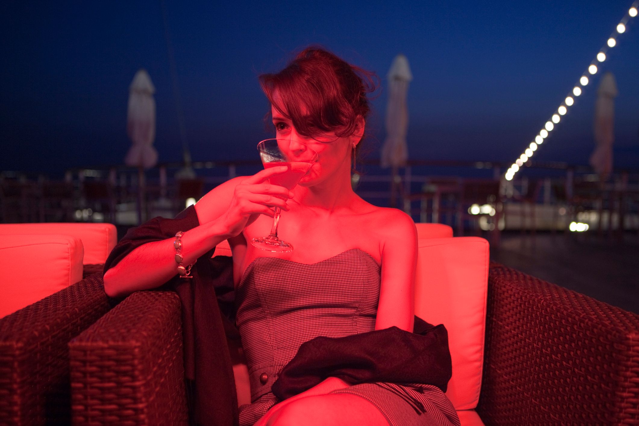 woman drinking cocktail